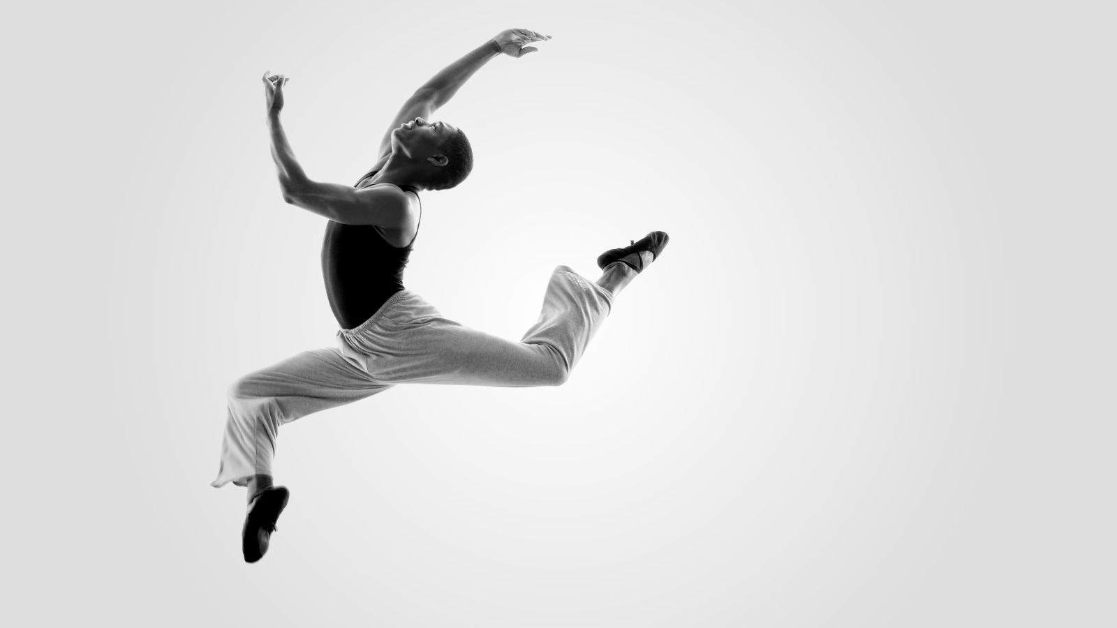 A male dancer in mid-leap