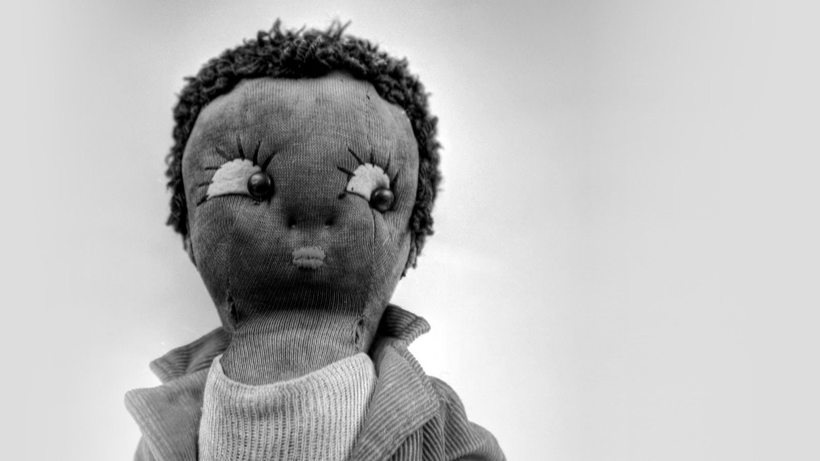 A stuffed doll of a black woman