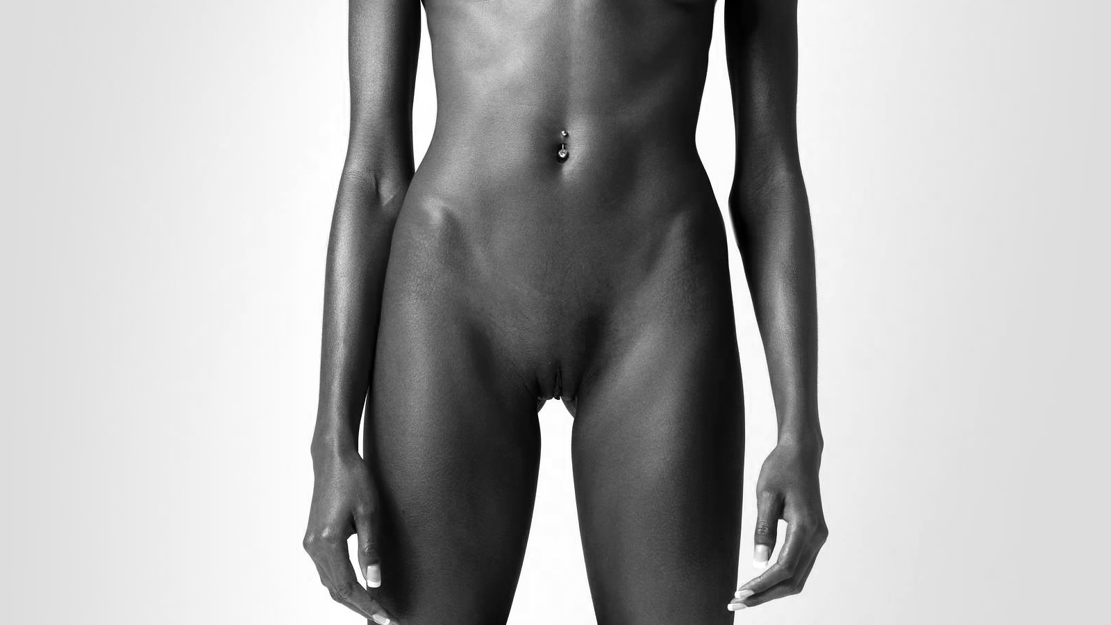 The naked midsection of a slim black woman